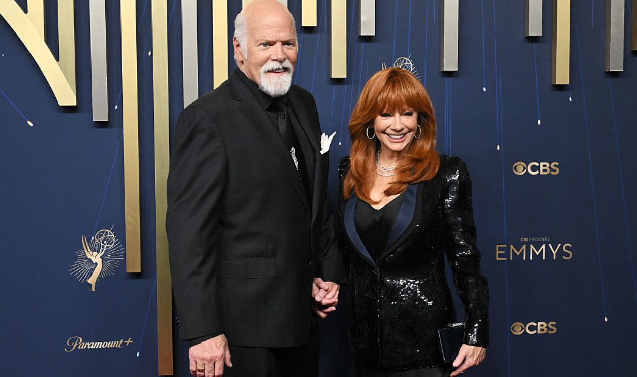 Rex Linn, Reba McEntire at the 77th Primetime Emmy Awards held at the Peacock Theater on September 14, 2025 in Los Angeles, California.