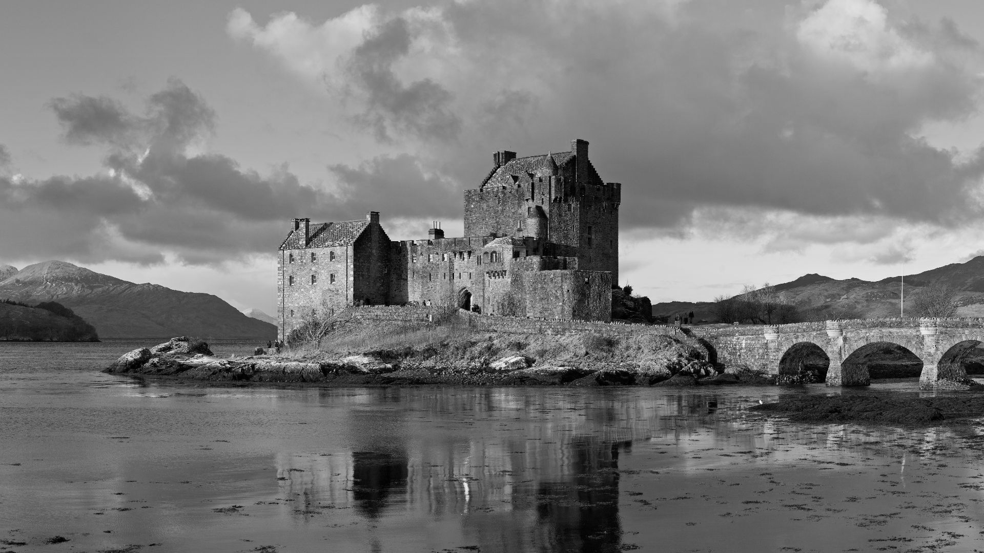 Eilean Donan Castle, as viewed from the south-east at sunrise. Taken by myself as a 2×6 segment panorama with a Canon 5D and 85mm f/1.8 lens.