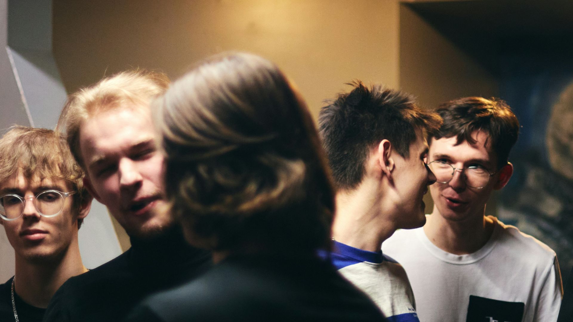 A group of people standing around each other