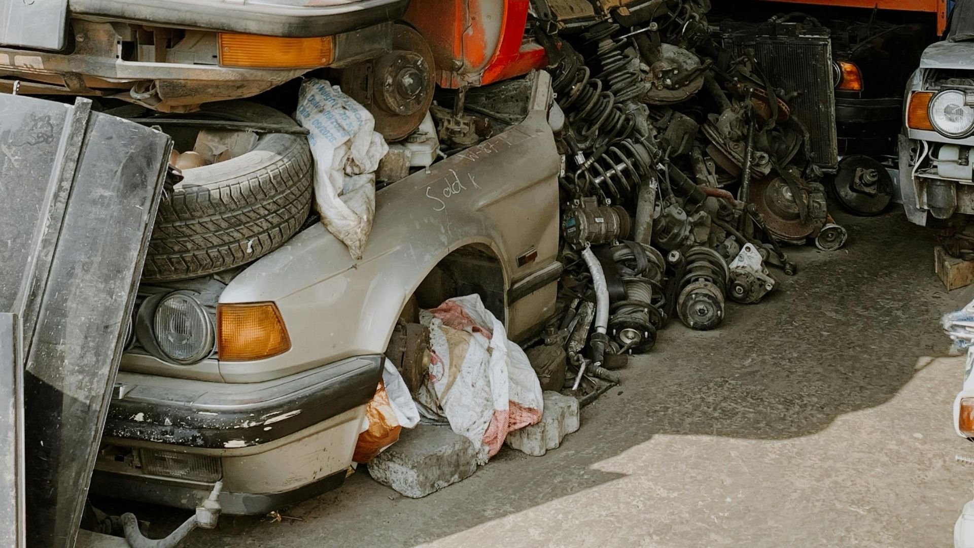 A pile of stacked cars in a junkyard in Sharjah, UAE.