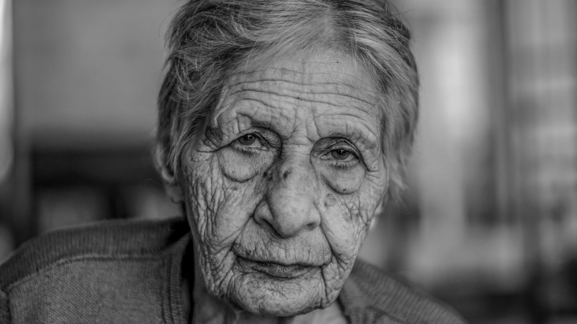 old woman in grey shirt