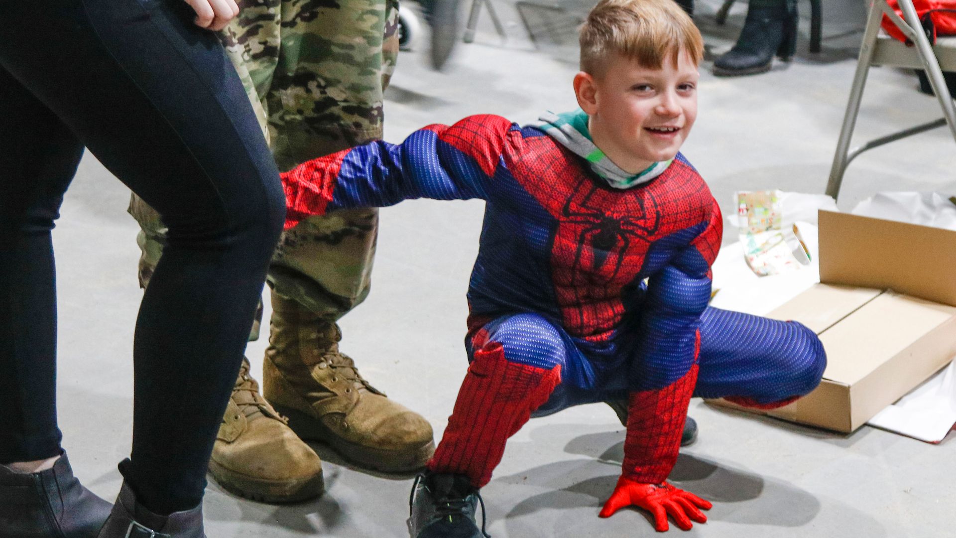 A young Polish boy who was a guest at the “Operation Christmas” party December 25 on the Bemowo Piskie Training Area NATO base camp near Bemowo Piskie, Poland, tries out his Christmas gift from the party - a Spiderman costume. (U.S. Army Reserve photo by Master Sgt. Ryan C. Matson, 652nd Regional Support Group)