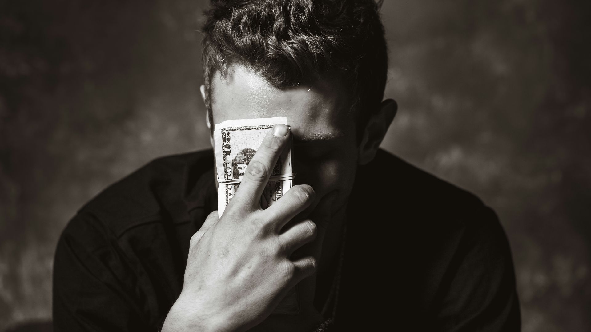 man holding banknote