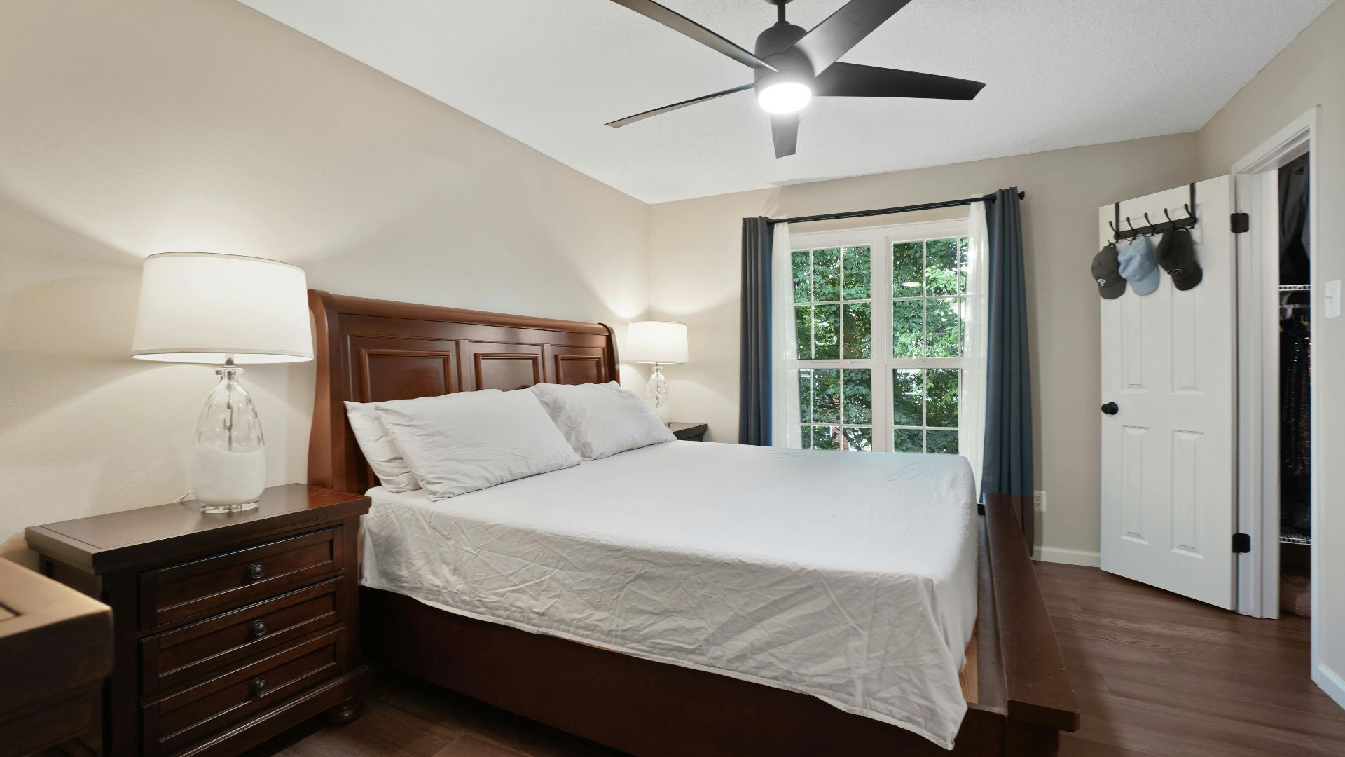 Cozy and modern bedroom with wooden furniture and minimalist decor.