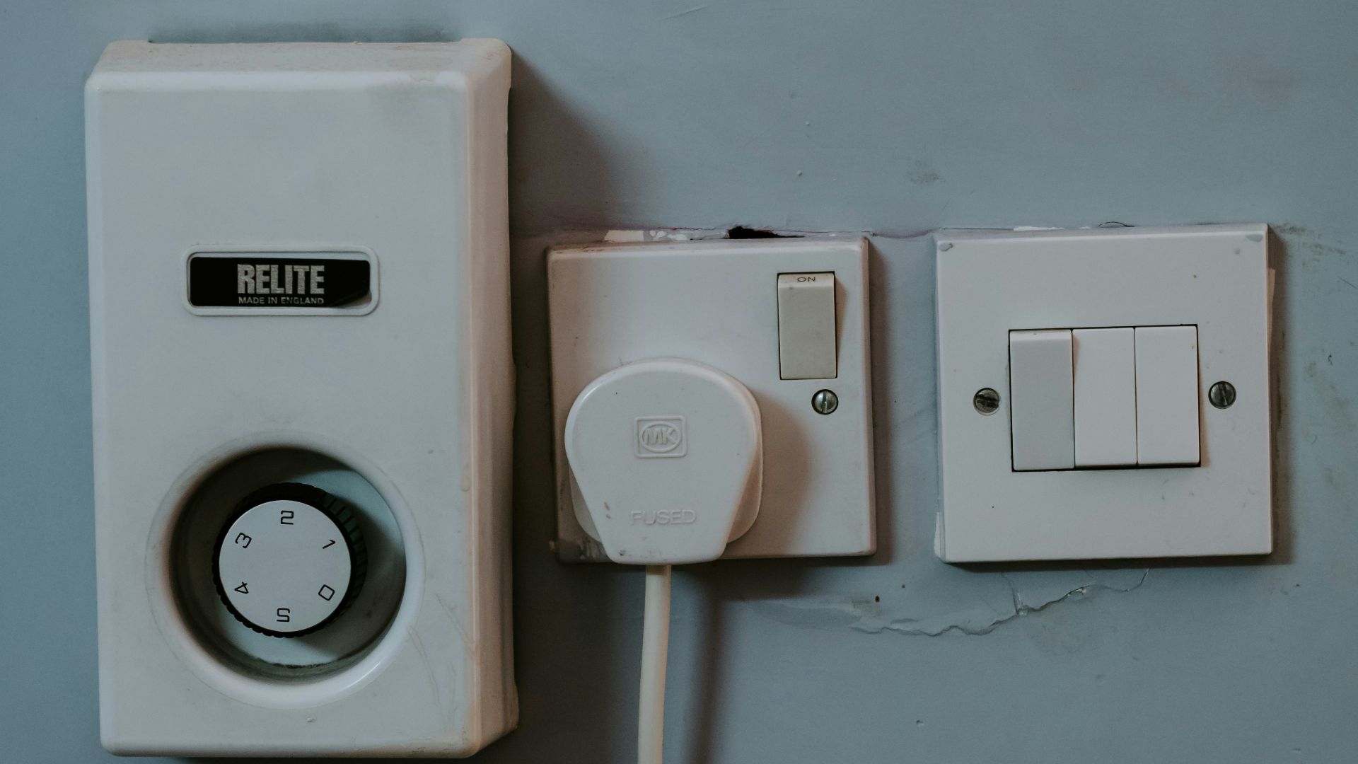 white wall mounted switch on white wall