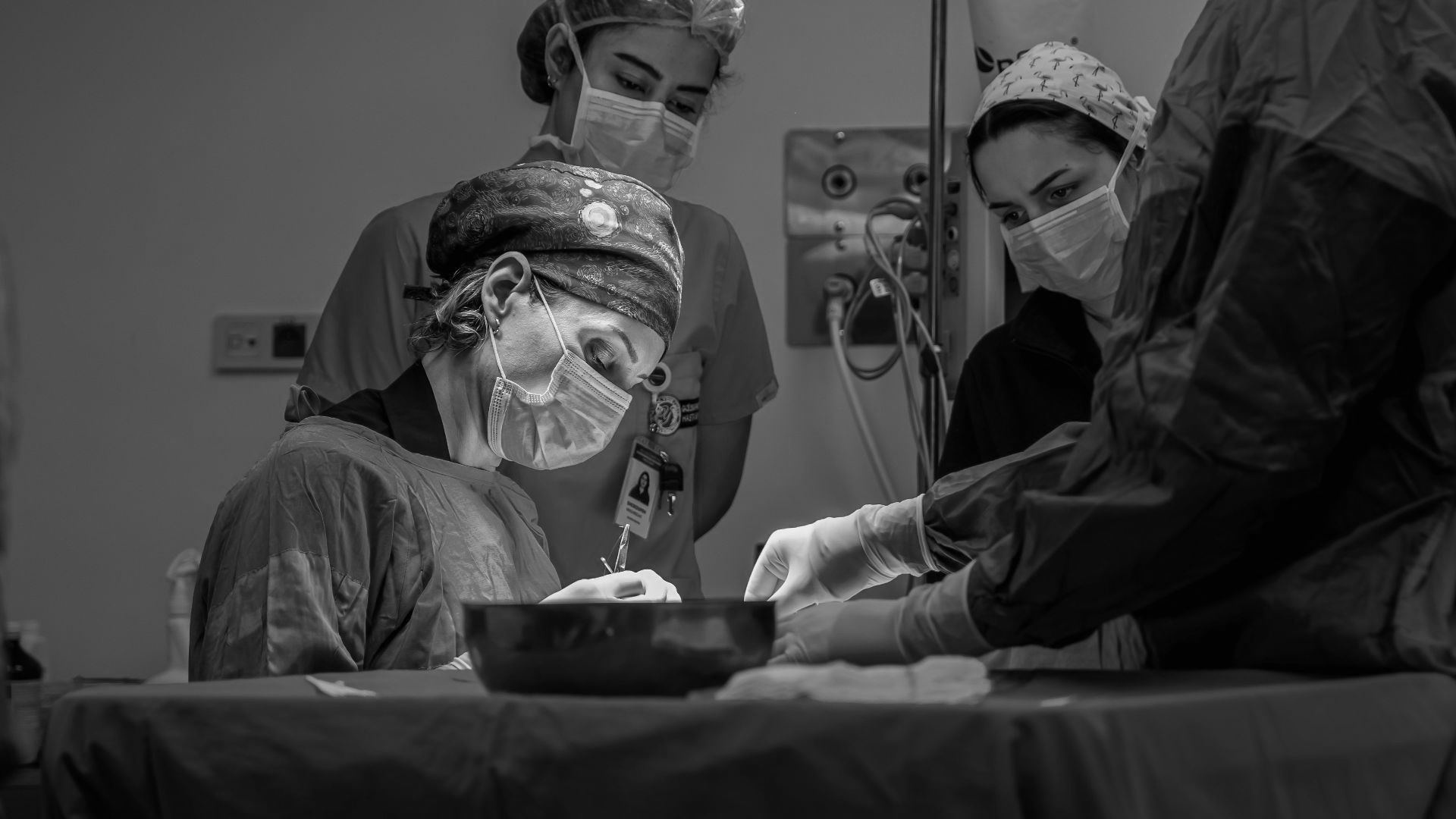 a group of doctors performing surgery on a patient