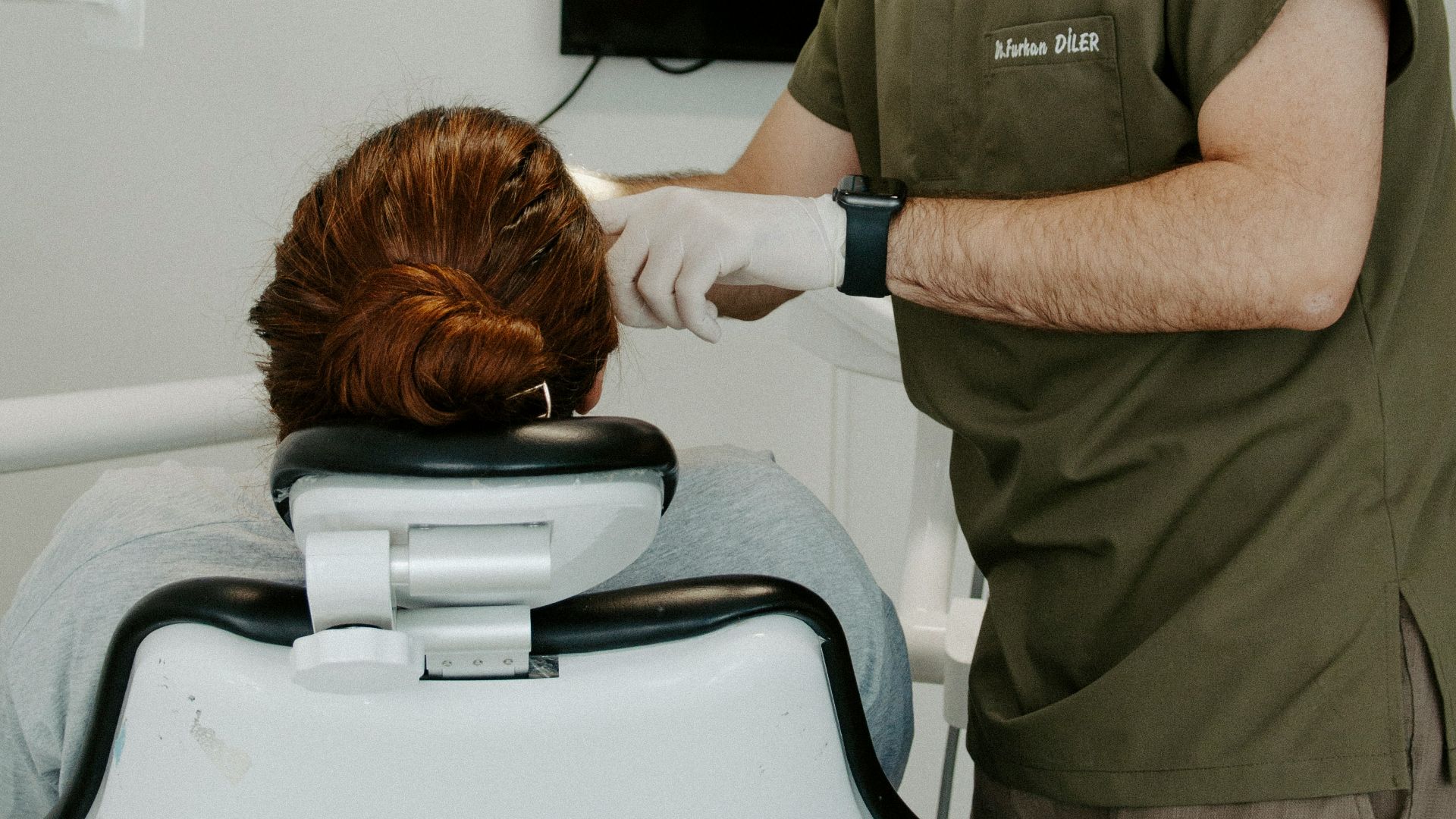 a dentist examining a patient