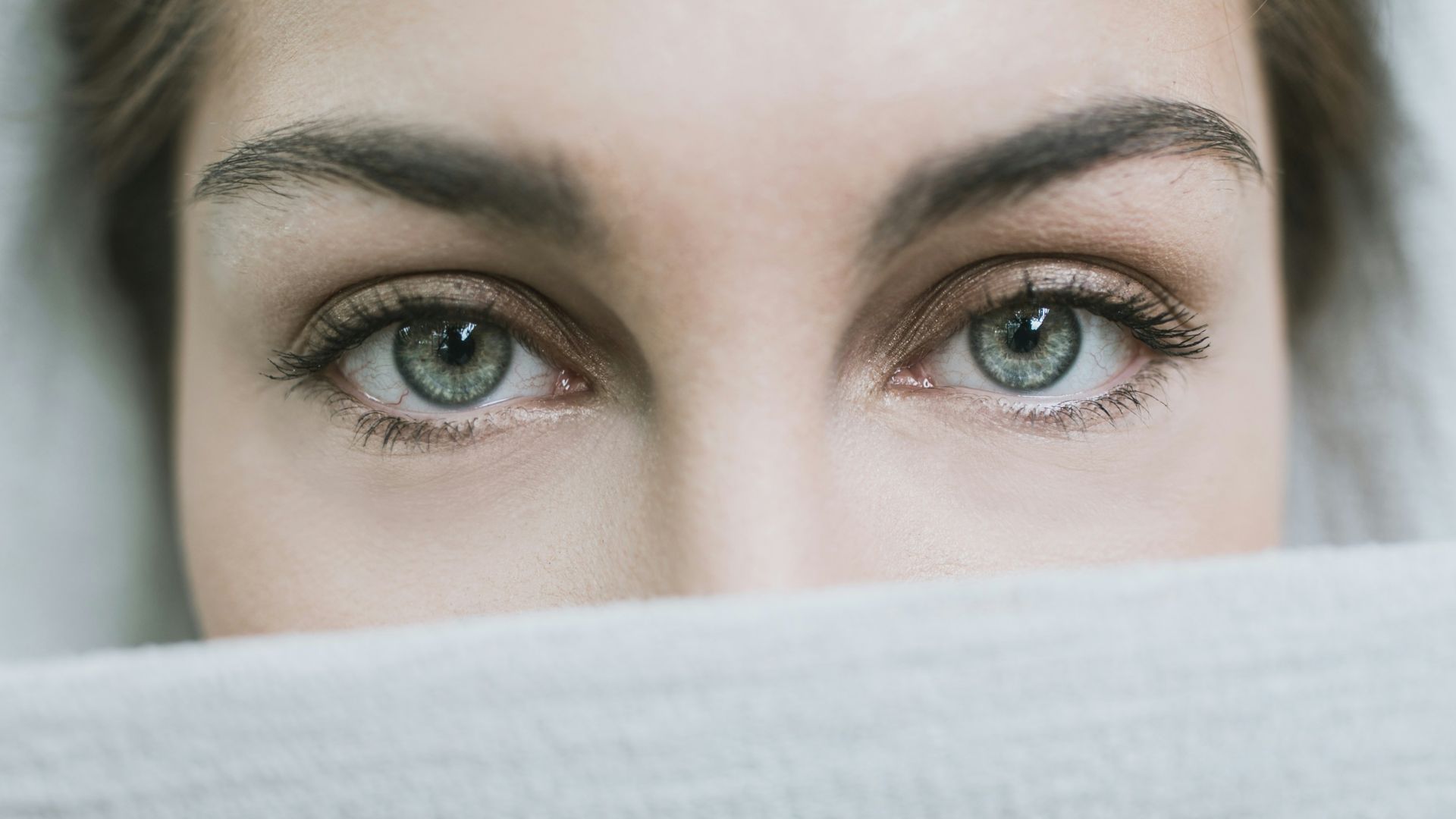 woman covered with white textile
