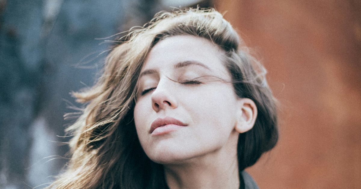 closeup photo of woman wearing black top