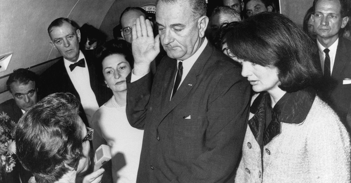 Vice President Lyndon B Johnson is sworn in to the office of the Presidency aboard Air Force One in Dallas, Texas