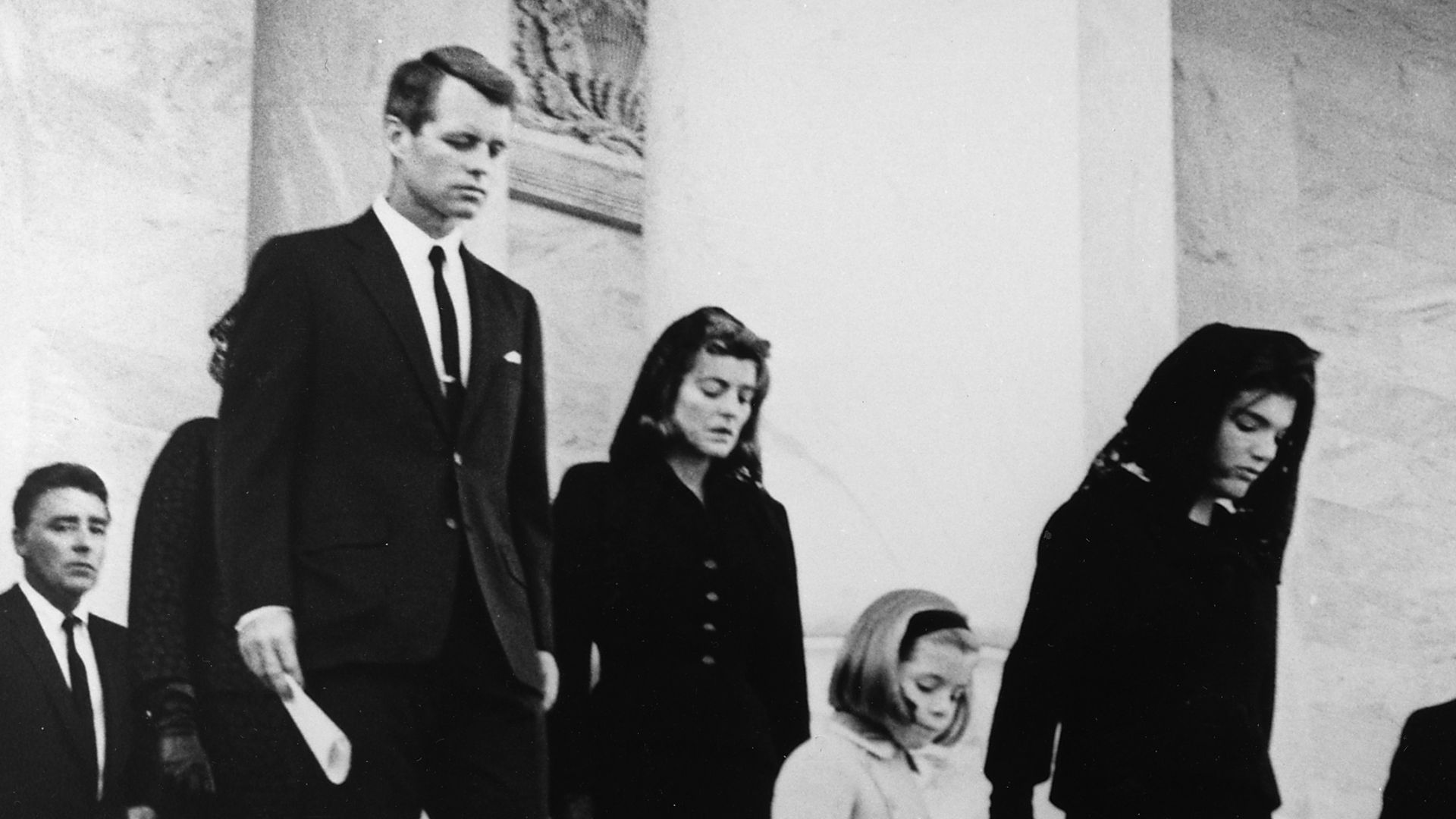 President's Family leaves Capitol after Ceremony. Caroline Kennedy, Jacqueline Bouvier Kennedy, John F. Kennedy, Jr. (2nd row) Attorney General Robert F. Kennedy, Patricia Kennedy Lawford (hidden) Jean Kennedy Smith (3rd Row) Peter Lawford. United States Capitol, East Front, Washington, D.C.