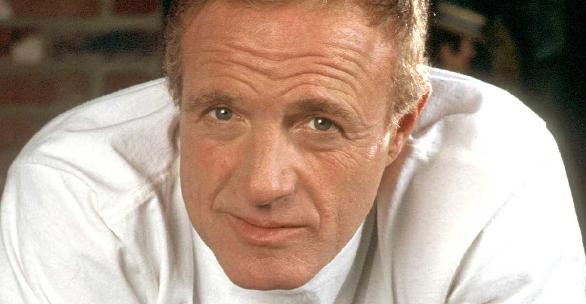 Close up of James Caan wearing a white t shirt.