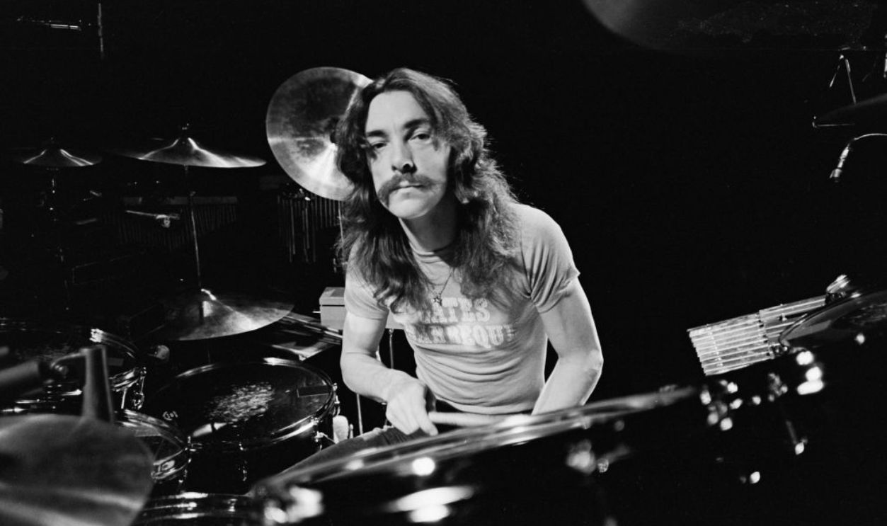 Drummer and lyricist Neil Peart (1952 - 2020) of Canadian progressive rock group, Rush, soundchecking at Memorial Coliseum, Fort Wayne, Indiana, 14th April 1977. The concert is part of the band's All The World's A Stage tour.
