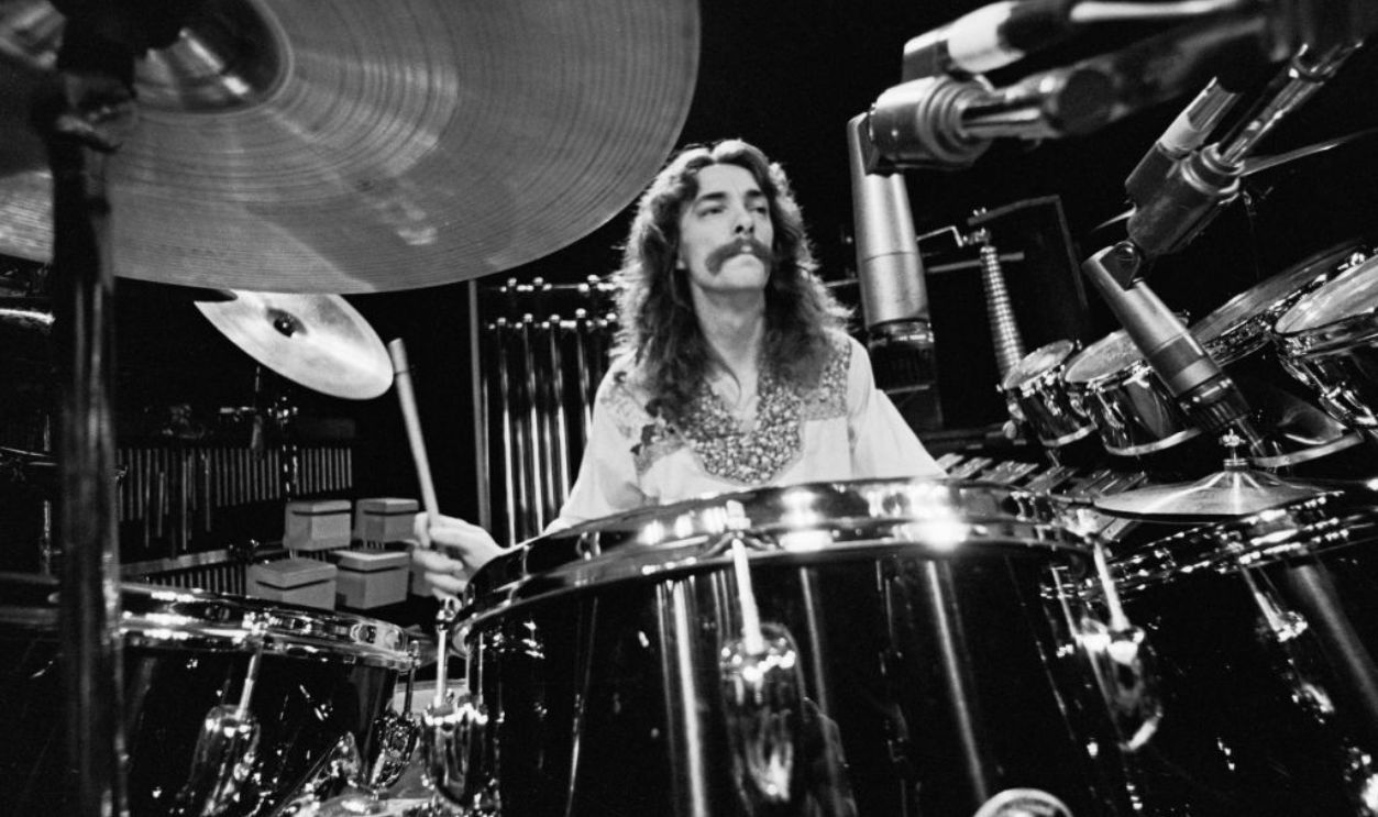 Drummer and lyricist Neil Peart (1952 - 2020) of Canadian progressive rock group, Rush, soundchecking at the Aragon Ballroom in Chicago, Illinois, 20th May 1977. The concert is part of the band's All The World's A Stage tour. 