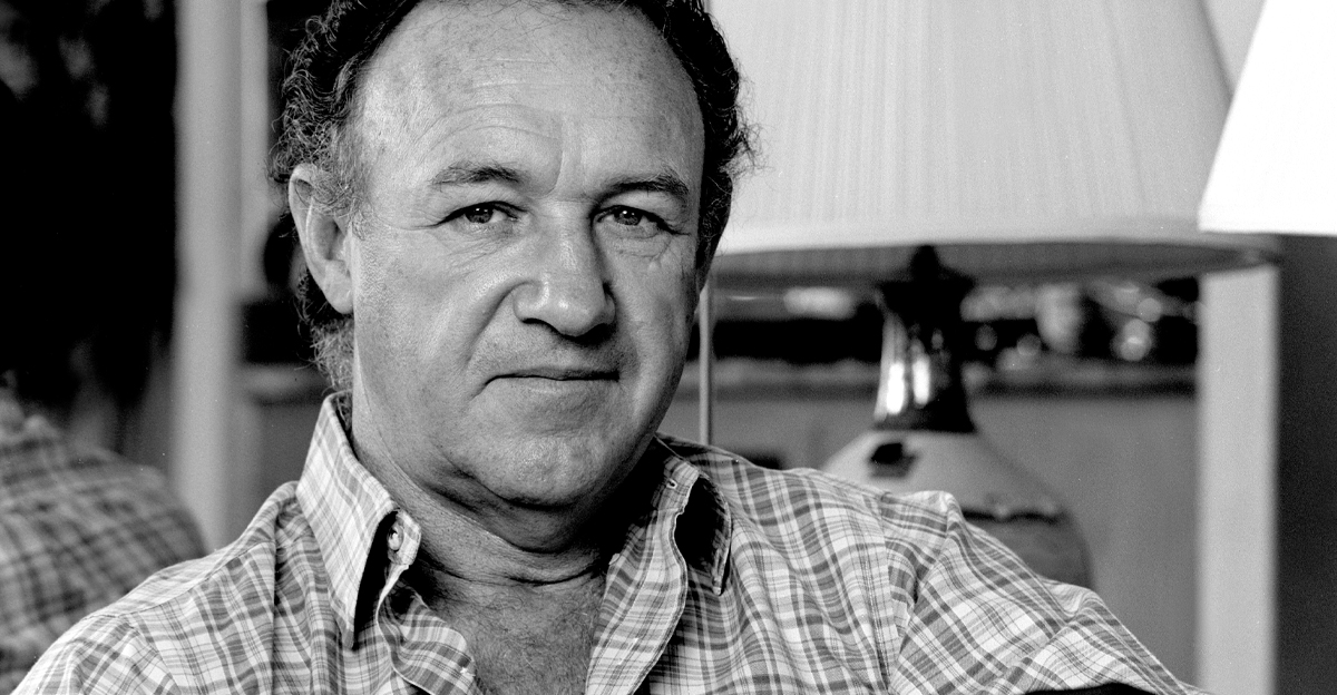 Black and white image of Gene Hackman in a plaid shirt.