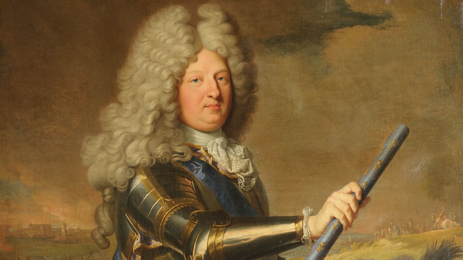 en armure, la taille ceinte de l'echarpe de commandement et levant de la main droite le bâton de maréchal. Présenté devant le siège de Philippsburg (1688)