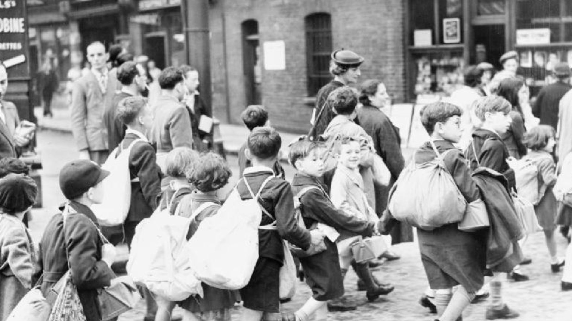 The Civilian Evacuation Scheme in Britain during the Second World War
Young children from the East End of London carrying their belongings, including their gas masks, as they set off on their journey to safer areas.
