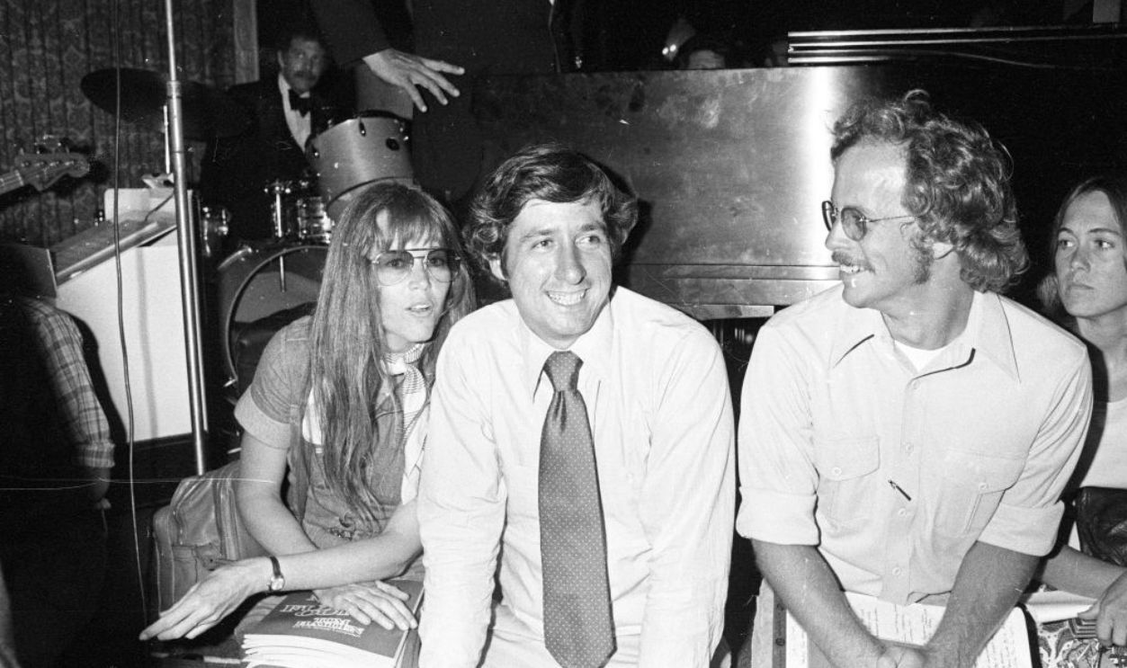 Actress Jane Fonda with activist Tom Hayden and unidentified man at a New York City Democratic Committee fundraiser..Article title: Happy daze are here again