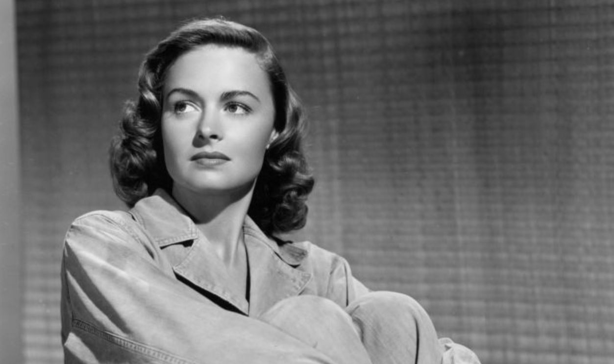 Donna Reed sitting on bench in a scene from the film 'They Were Expendable', 1945. 