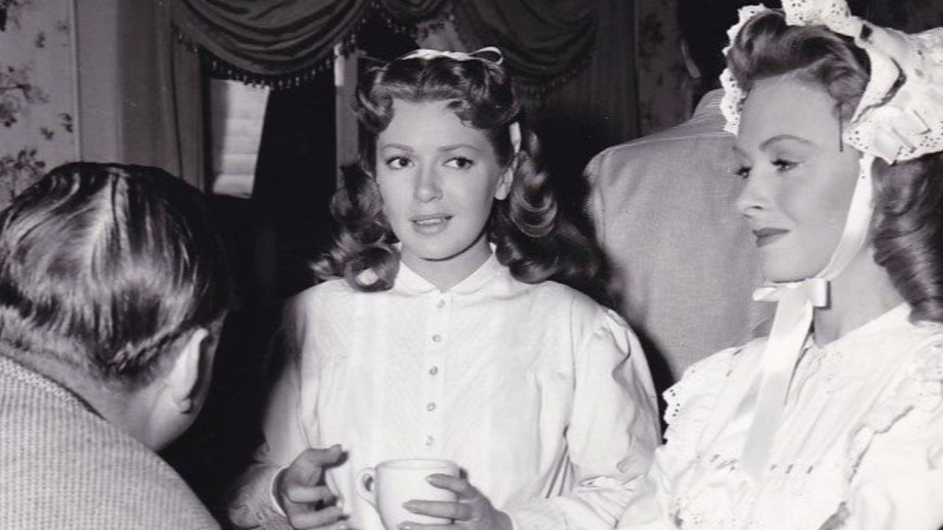 Lana Turner and Donna Reed on set of Green Dolphin Street with director Victor Saville