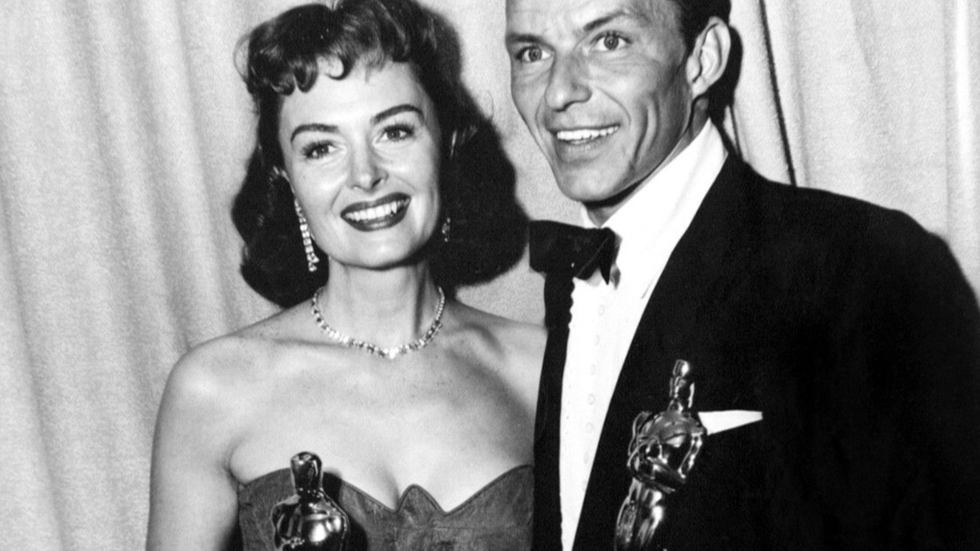 Donna Reed and Frank Sinatra hold their gold-plated Oscars at the 26th Academy Awards ceremony held on March 25, 1954.