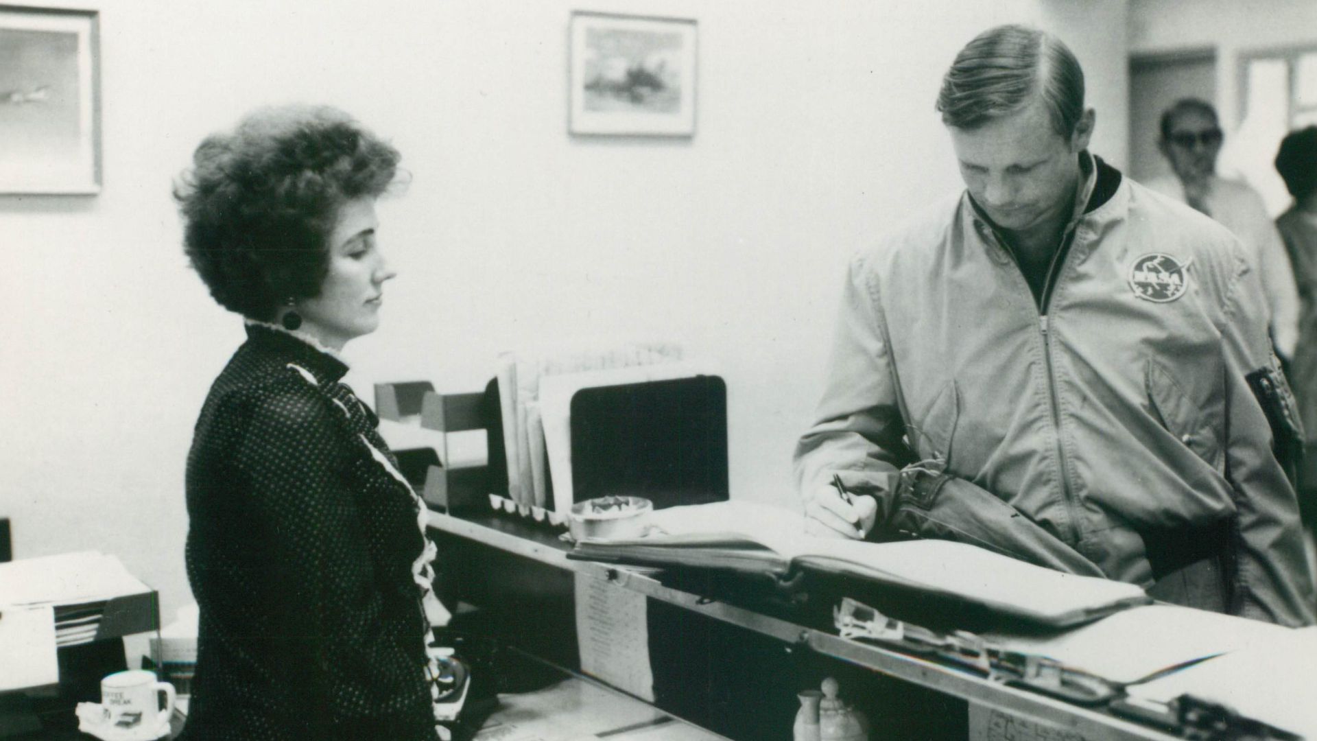 Neil Armstrong signing into Building 1244 at Langley Research Center.
