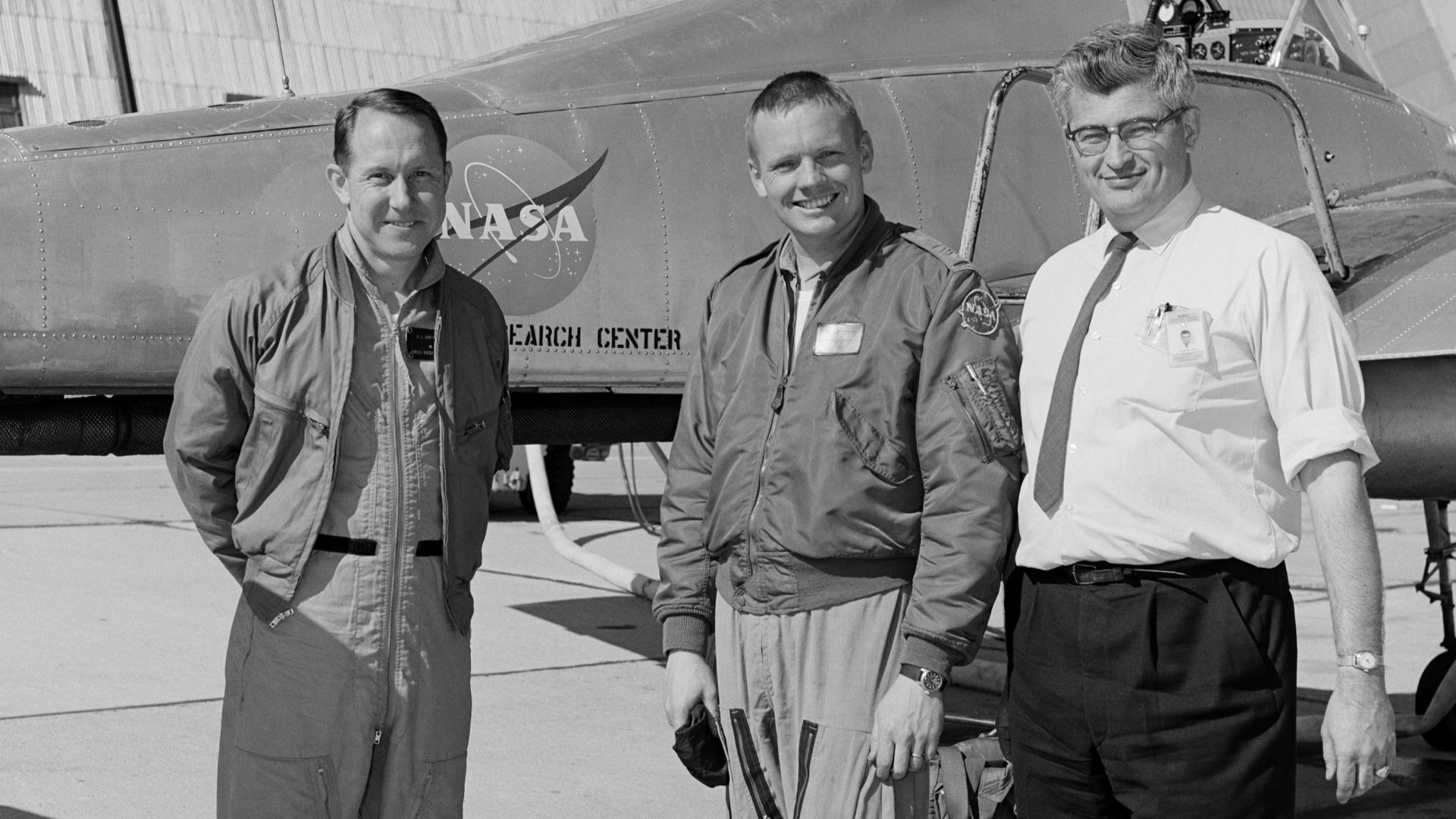 Ames test pilot Fred Drinkwater, astronaut Neil Armstrong, and Ames project engineer Stu Rolls in front of the Ames Bell X-14 airplane being flown by Armstrong in February of 1964, five years before Armstrong landed on the moon.