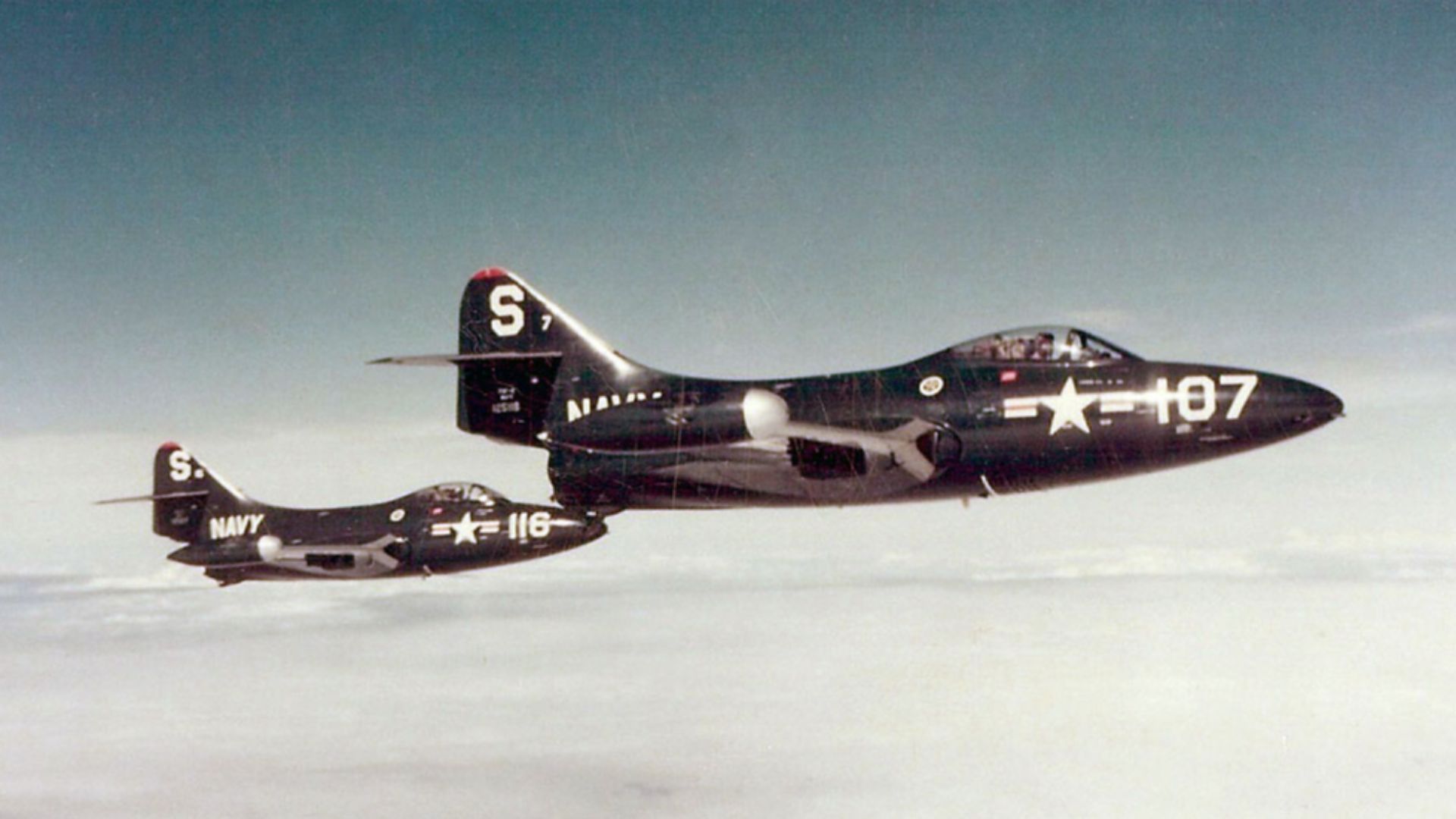Two U.S. Navy Grumman F9F-2 Panther jets from Fighter Squadron 51 (VF-51)