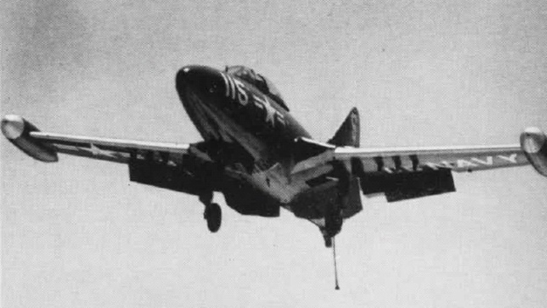 A Grumman F9F-2 Panther of fighter squadron VF-51 Screaming Eagles approaching the U.S. aircraft carrier USS Essex (CV-9). VF-51 was assigned to Carrier Air Group Five (CVG-5) during a deployment to Korea from 26 June 1951 to 25 March 1952. Note the