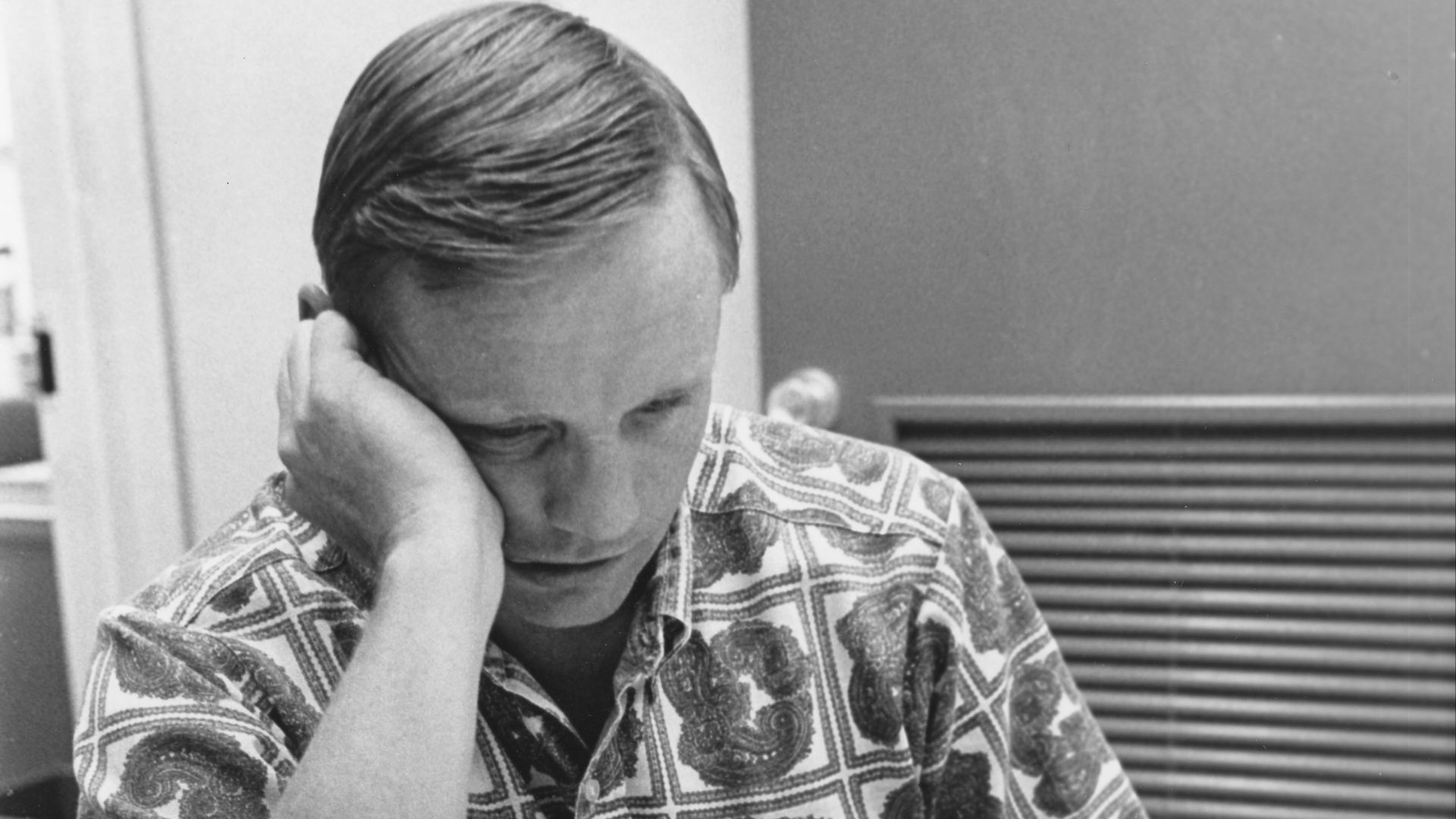 Neil Armstrong reviews flight plans. Photo filed 14 July 1969.