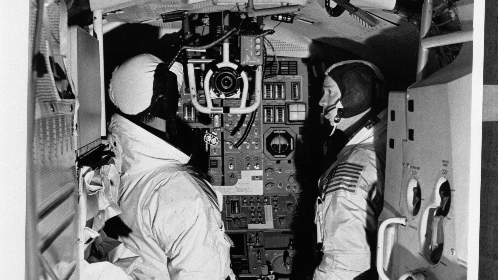 S69-19858 (December 1968) --- Two members of the Apollo 9 prime crew participate in simulation training in the Apollo Lunar Module Mission Simulator (LMMS) at the Kennedy Space Center (KSC). On the left is astronaut James A. McDivitt, commander; and on the right is astronaut Russell L. Schweickart, lunar module pilot.