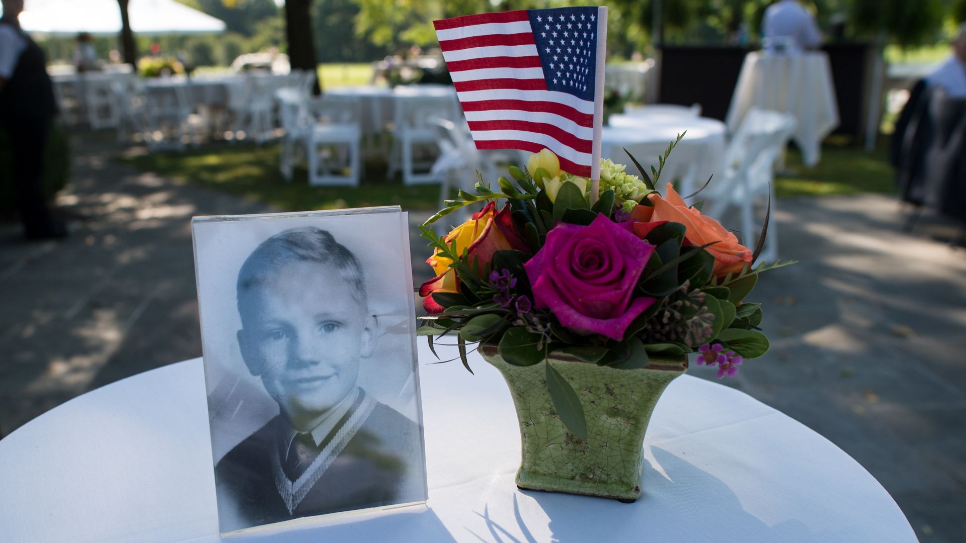 A photograph of astronaut Neil Armstrong as a boy is displayed on a table during a memorial service celebrating his life on Friday, 31 August 2012, at the Camargo Club in Indian Hill near Cincinnati. Armstrong, the first man to walk on the moon during the 1969 Apollo 11 mission, died on Saturday, 25 August. He was 82.