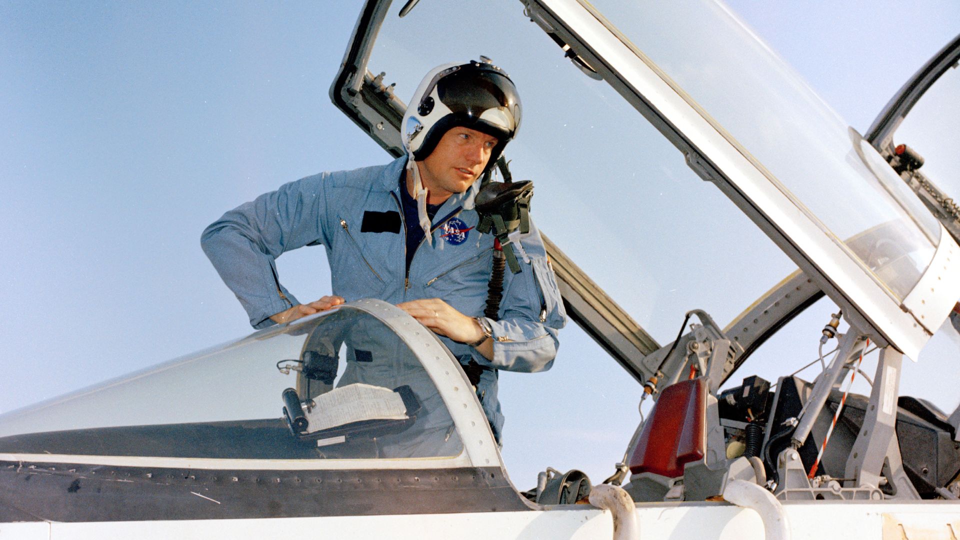 Neil Armstrong climbing out of the cockpit of a T-38, after arrival at Patrick Air Force Base. Photo filed 17 June 1969.