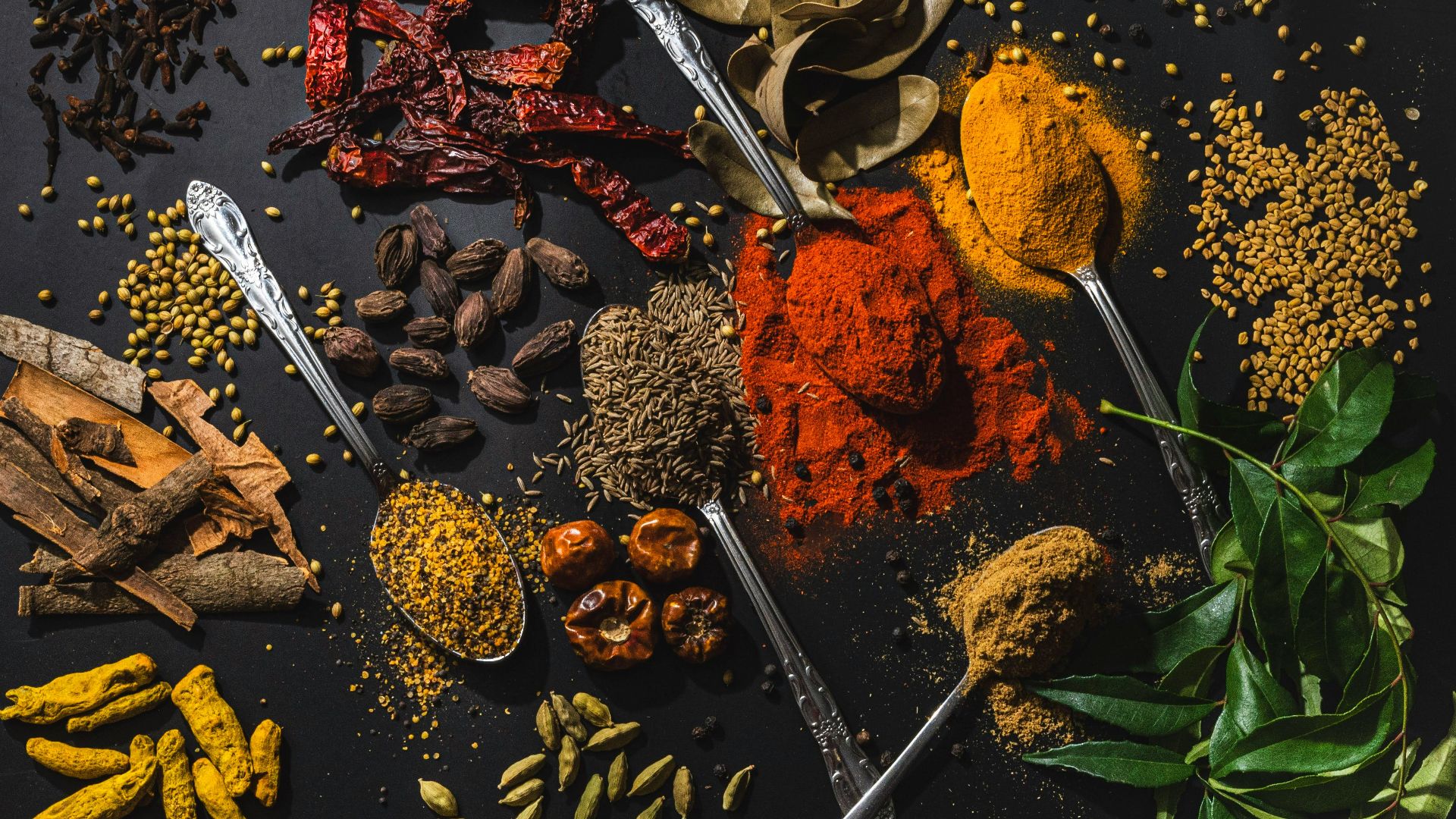 a table topped with different types of spices