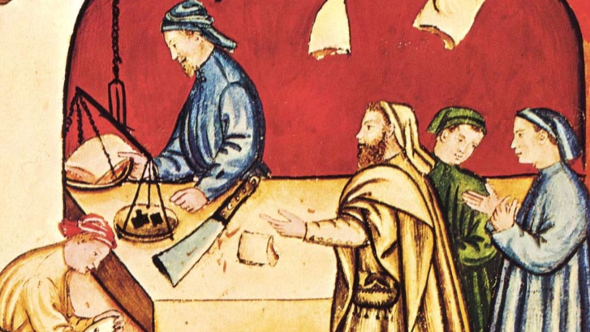 This picture is showing a 14th century butcher doing his trade in a traditional manner