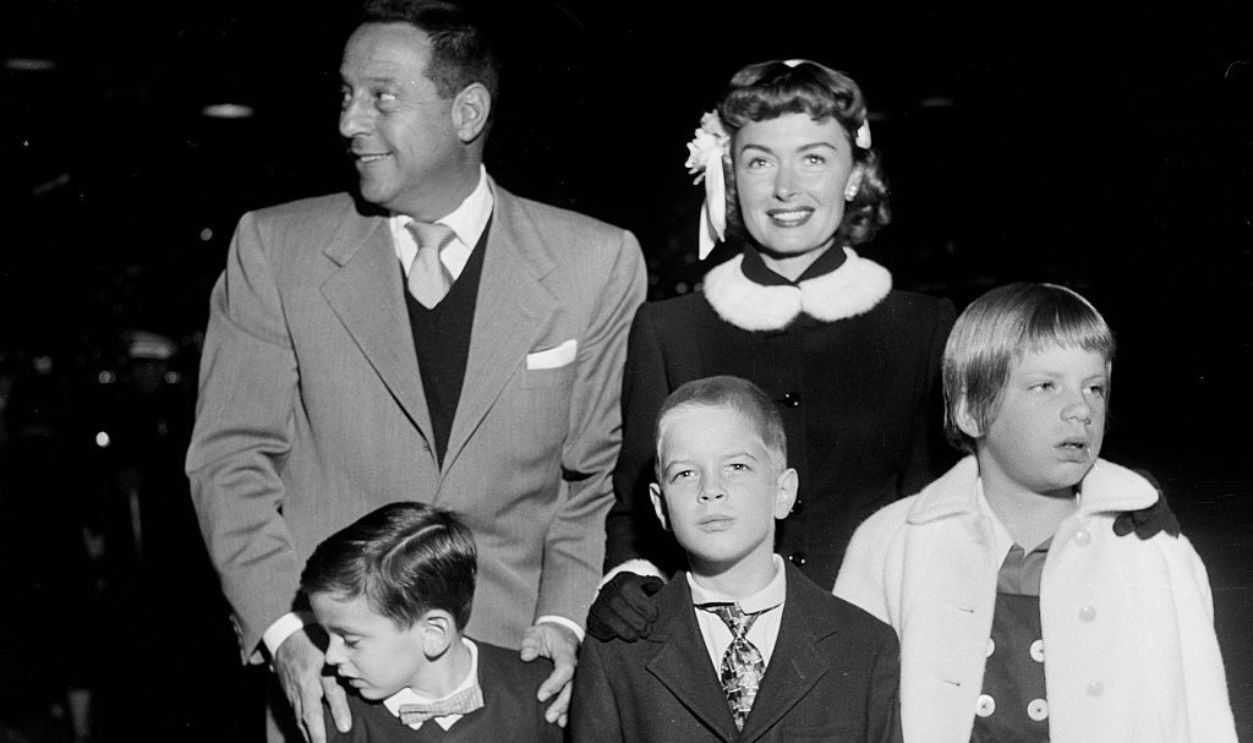 LOS ANGELES,CA - DECEMBER 18,1954: Actress Donna Reed with husband Tony Owens attend a premiere with their kids Timmy,5, Tony Jr. 7, and Penny 8, in Los Angeles,CA. 