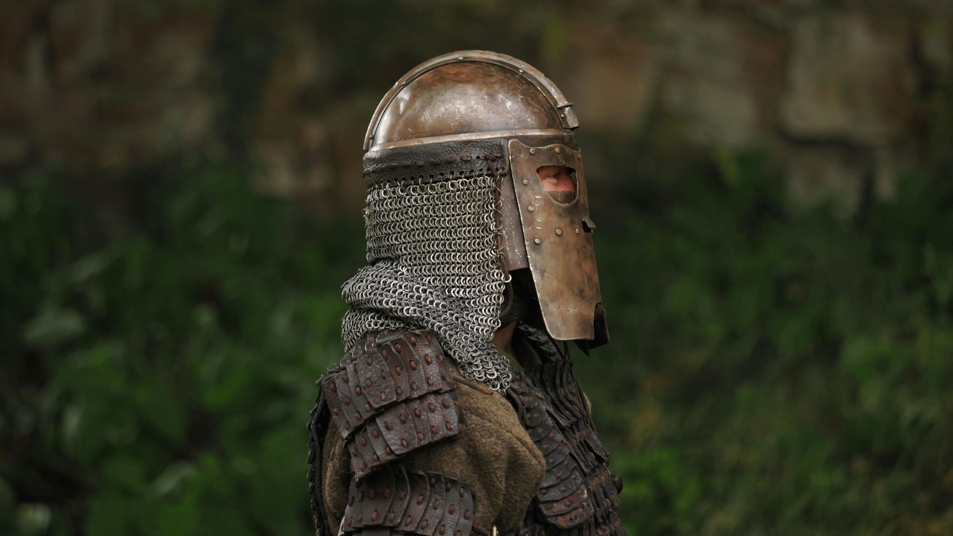 A knight in full medieval armor standing outdoors in Höxter, Germany.