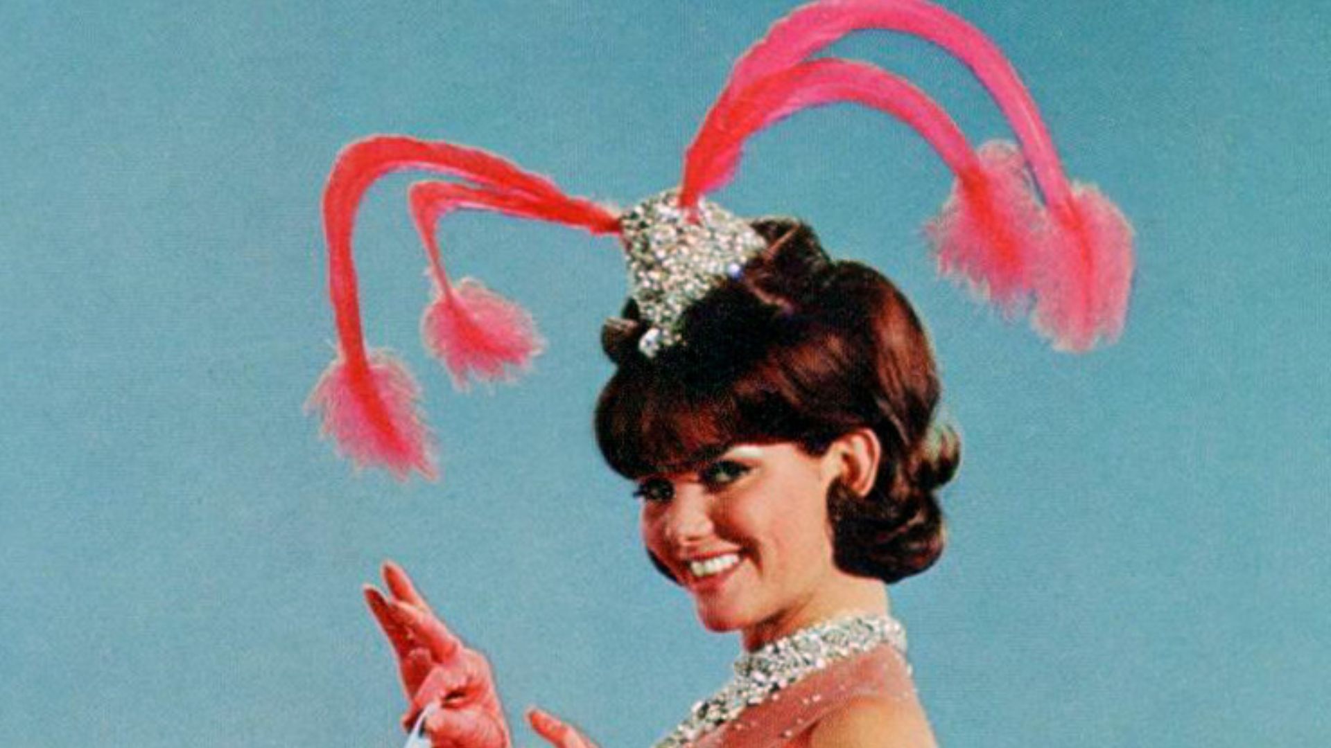 Postcard photo of Claudia Cardinale promoting w:Blindfold (film).  She's seen in one of her costumes from the film.