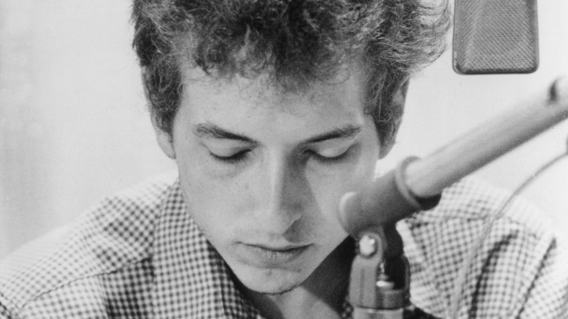 Bob Dylan, 1963 promo photo by Don Hunstein for The Times They Are a-Changin' in a recording studio.