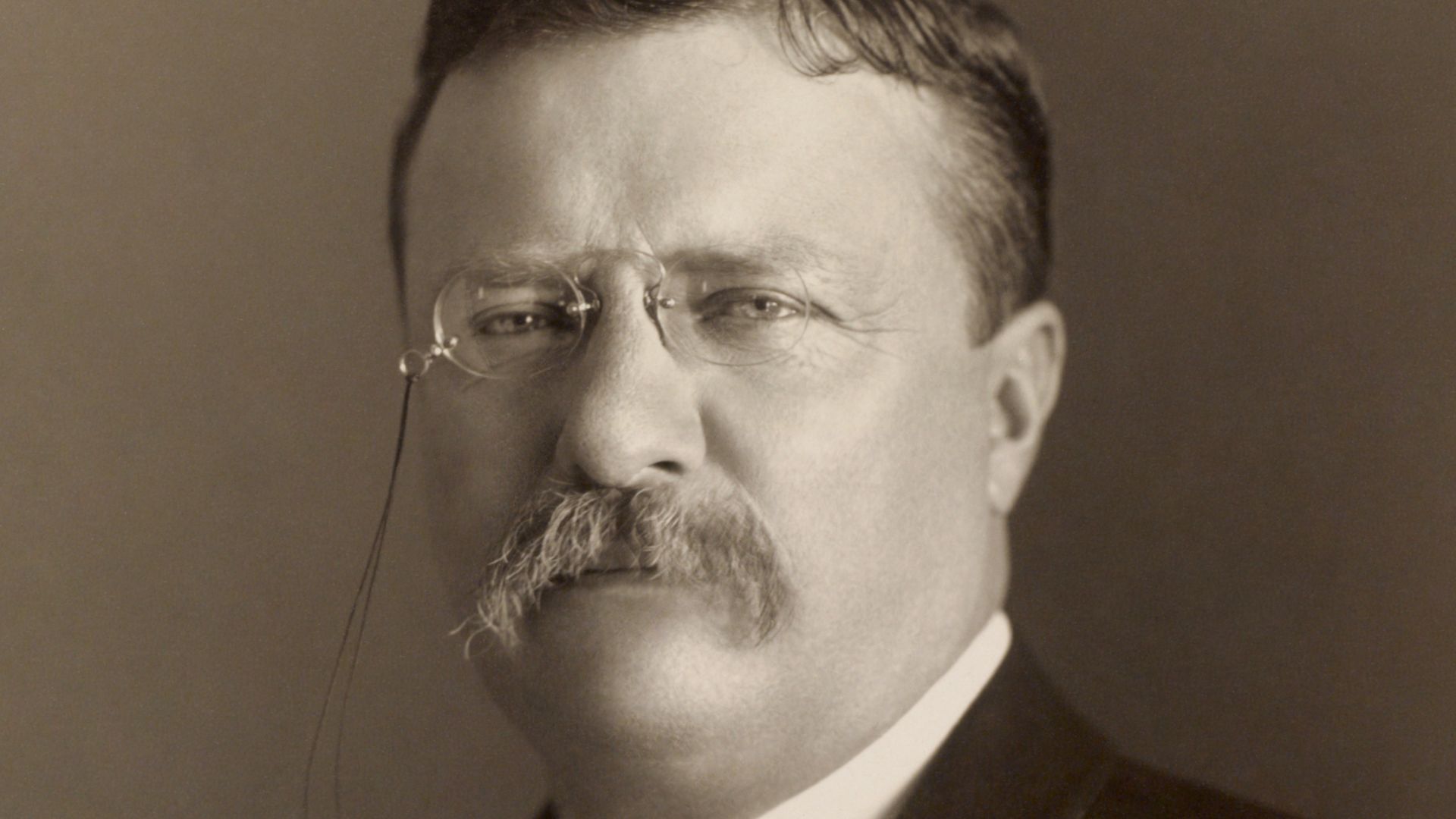 Photograph of Theodore Roosevelt showing head and shoulders, facing slightly left. No information on size of the photo given.
Restoration notes
Lots of scratches, which I carefully removed. Mainly just a dust and scratch removal, but I did apply a very slight sharpening to the right half of his moustache.