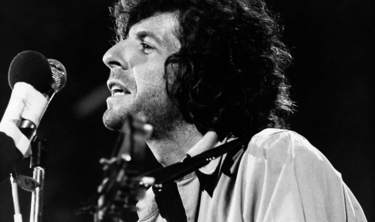 ISLE OF WIGHT, UK - AUGUST 30: Canadian singer Leonard Cohen performs on stage at the Isle of Wight Festival on August 30 1970.