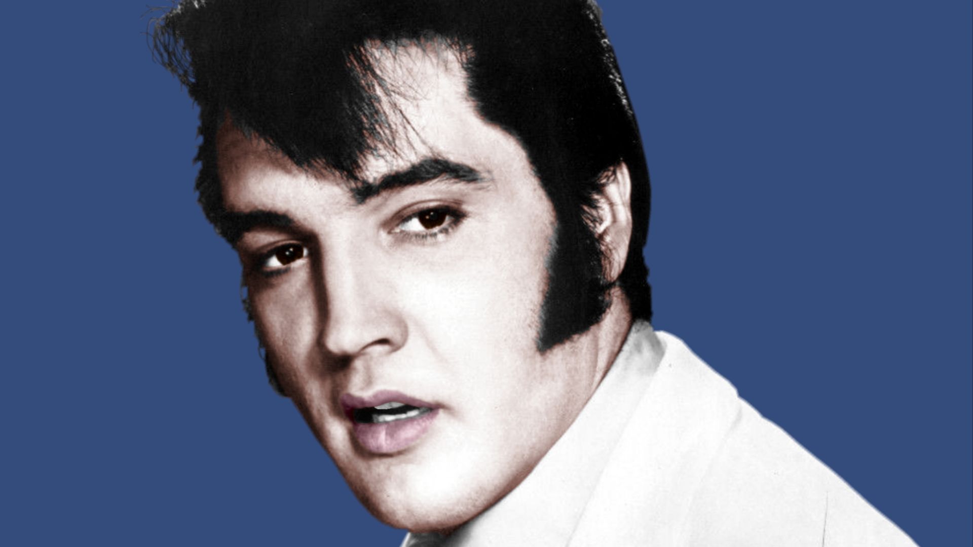 Recoloured version of a black and white image from Wikimedia Commons: https://commons.wikimedia.org/wiki/File:Elvis_Presley_Publicity_Photo_for_The_Trouble_with_Girls_1968.jpg