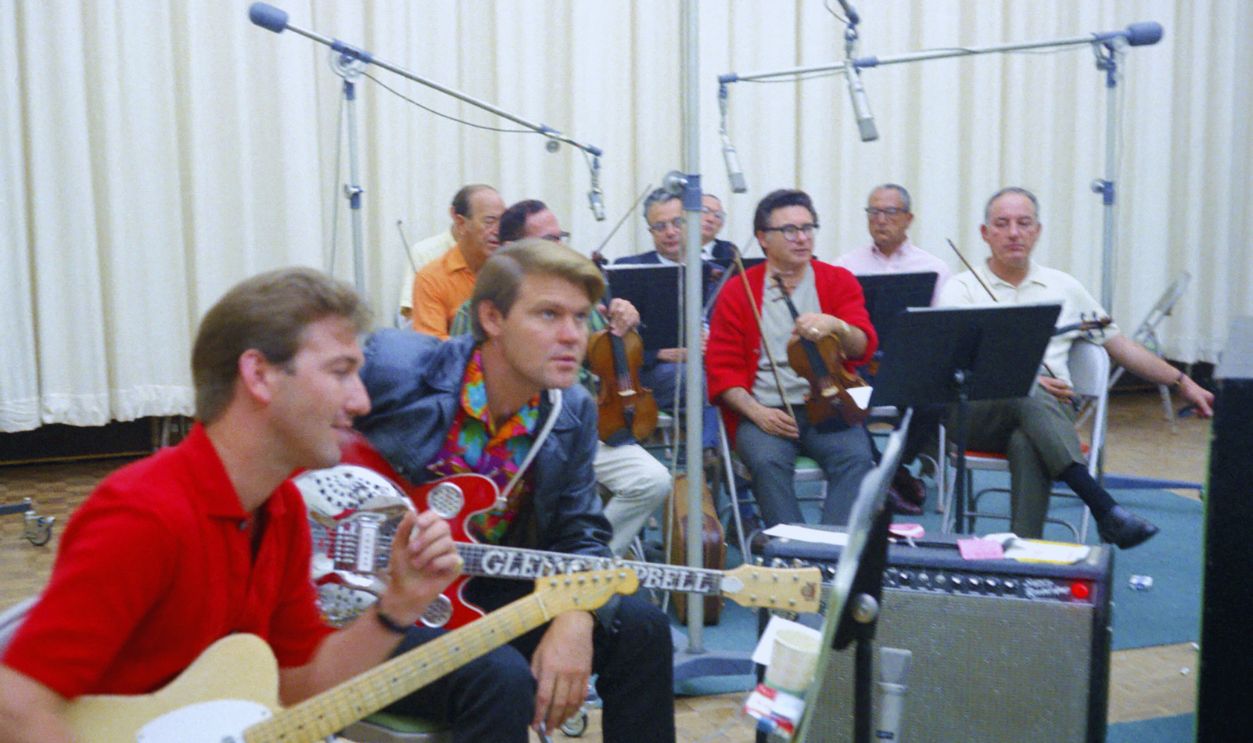 Gettyimages  - 74256388, Glen Campbell And James Burton LOS ANGELES - SEPTEMBER 15: Singer and Songwriter Glen Campbell (R) and guitarist James Burton (L) record at the Columbia Records Studio on September 15, 1967 in Los Angeles, California. 