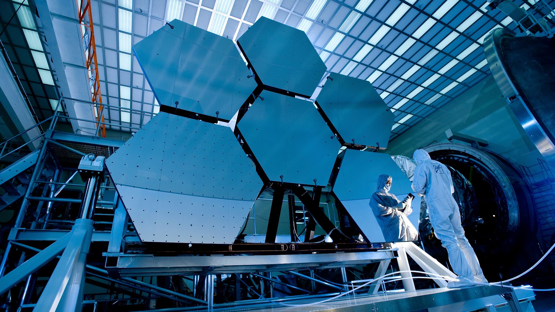 Caption: During cryogenic testing, the mirrors will be subjected to temperatures dipping to 24 Kelvins, permitting engineers to measure in extreme detail how the shape of each mirror changes as it cools. More information: Click here