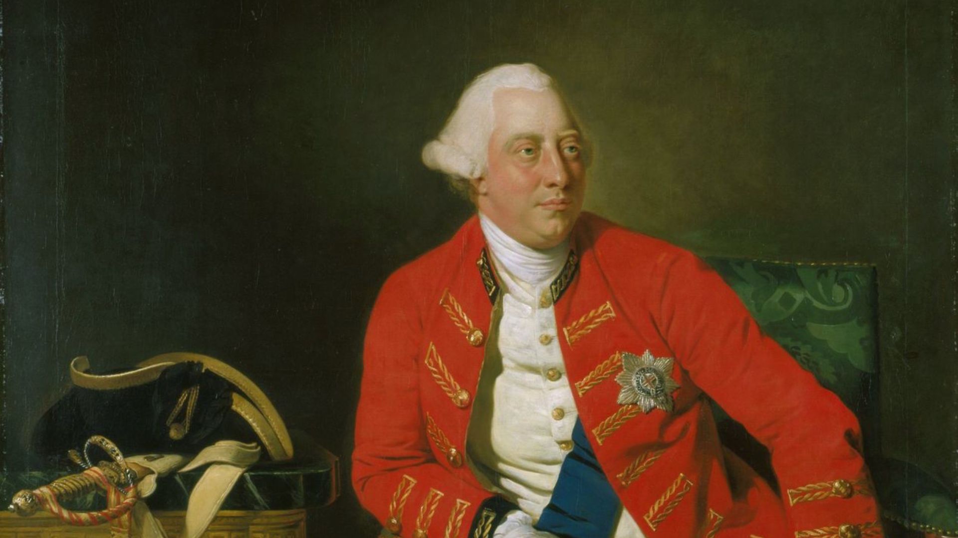 A three quarter length figure of King George III seated in a General Officer's coat with the ribbons and star of the Garter, wearing the Garter around his leg; his hat and sword resting on a nearby table. Finished in 1771 it portrays the king at age 33, with a steady serious gaze, a ruddy healthy face, and a calm assured demeanor.