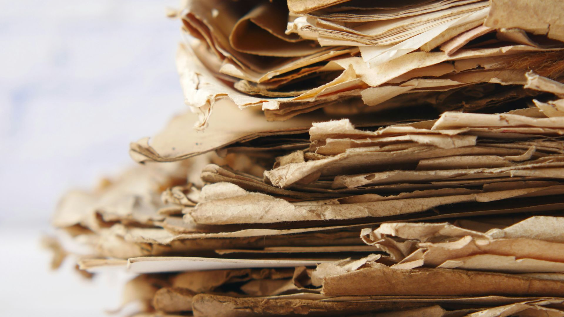 a close up of a pile of paper on a table