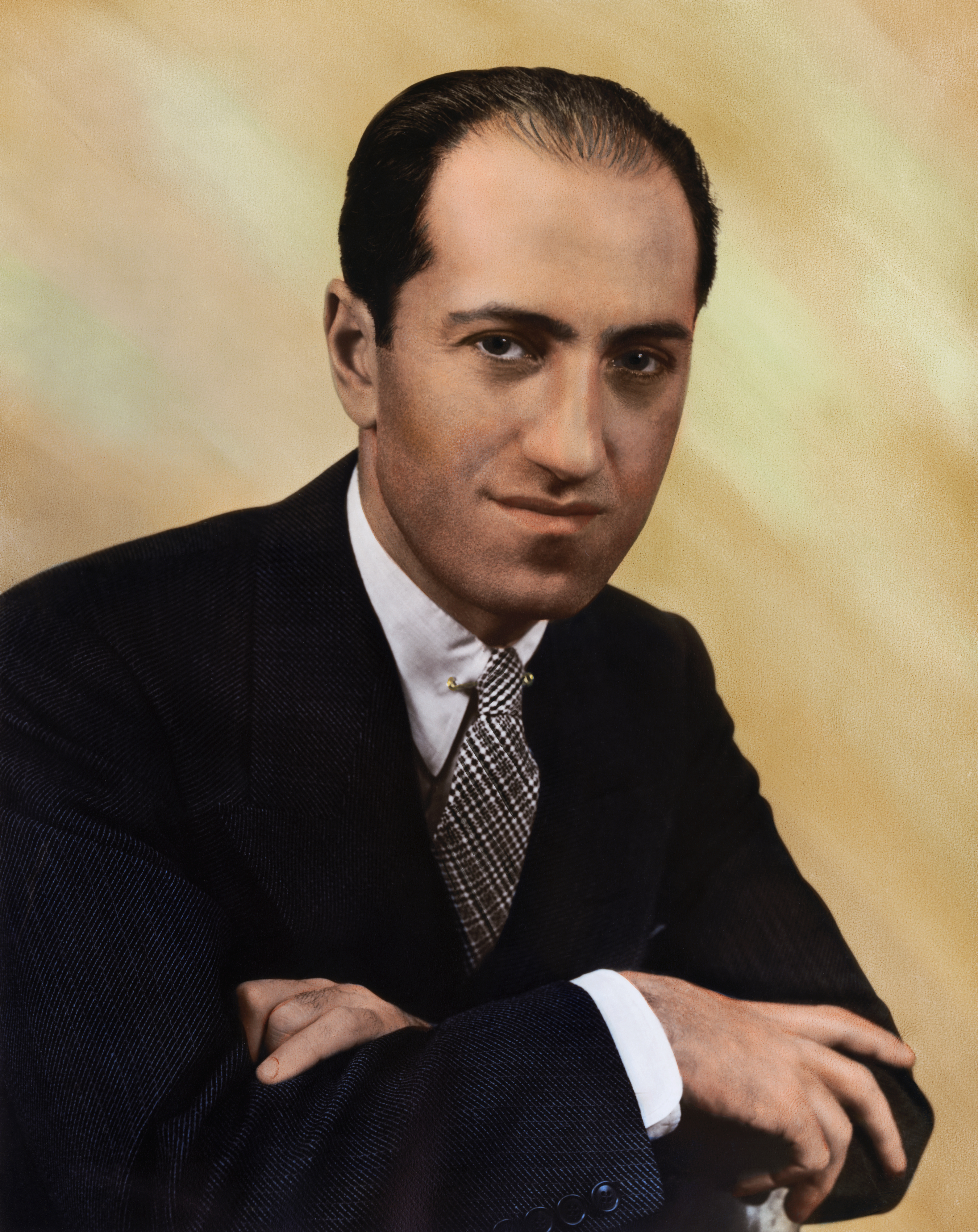 American composer George Gershwin (1898-1937) in a hand-tinted photographic portrait from the 1930s.