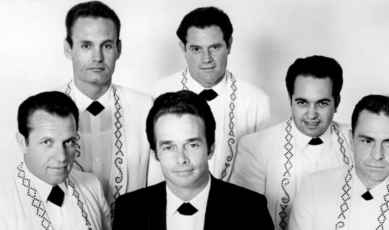 CIRCA 1967: Country musician Merle Haggard poses with his band 