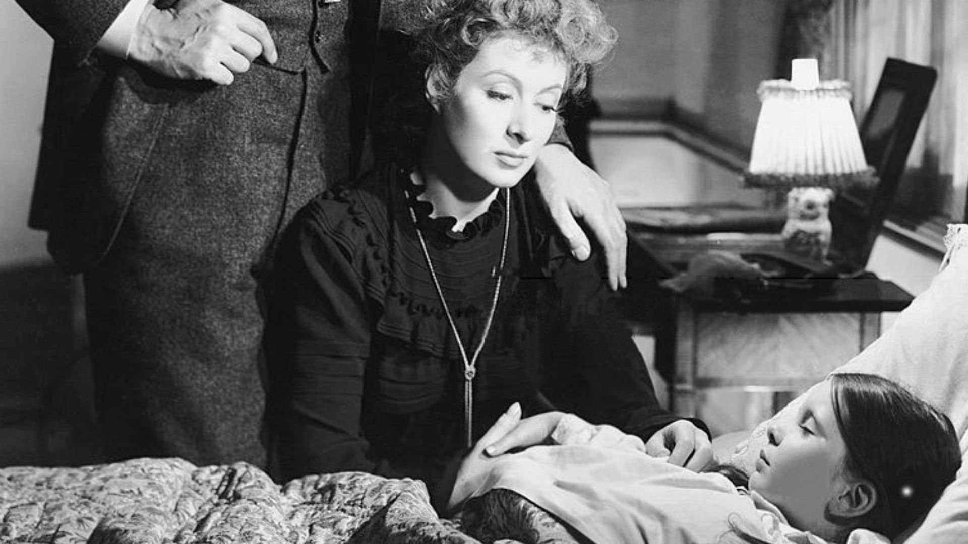 Promotional photograph for the 1943 film Madame Curie
From left: Walter Pidgeon, Greer Garson, Margaret O'Brien