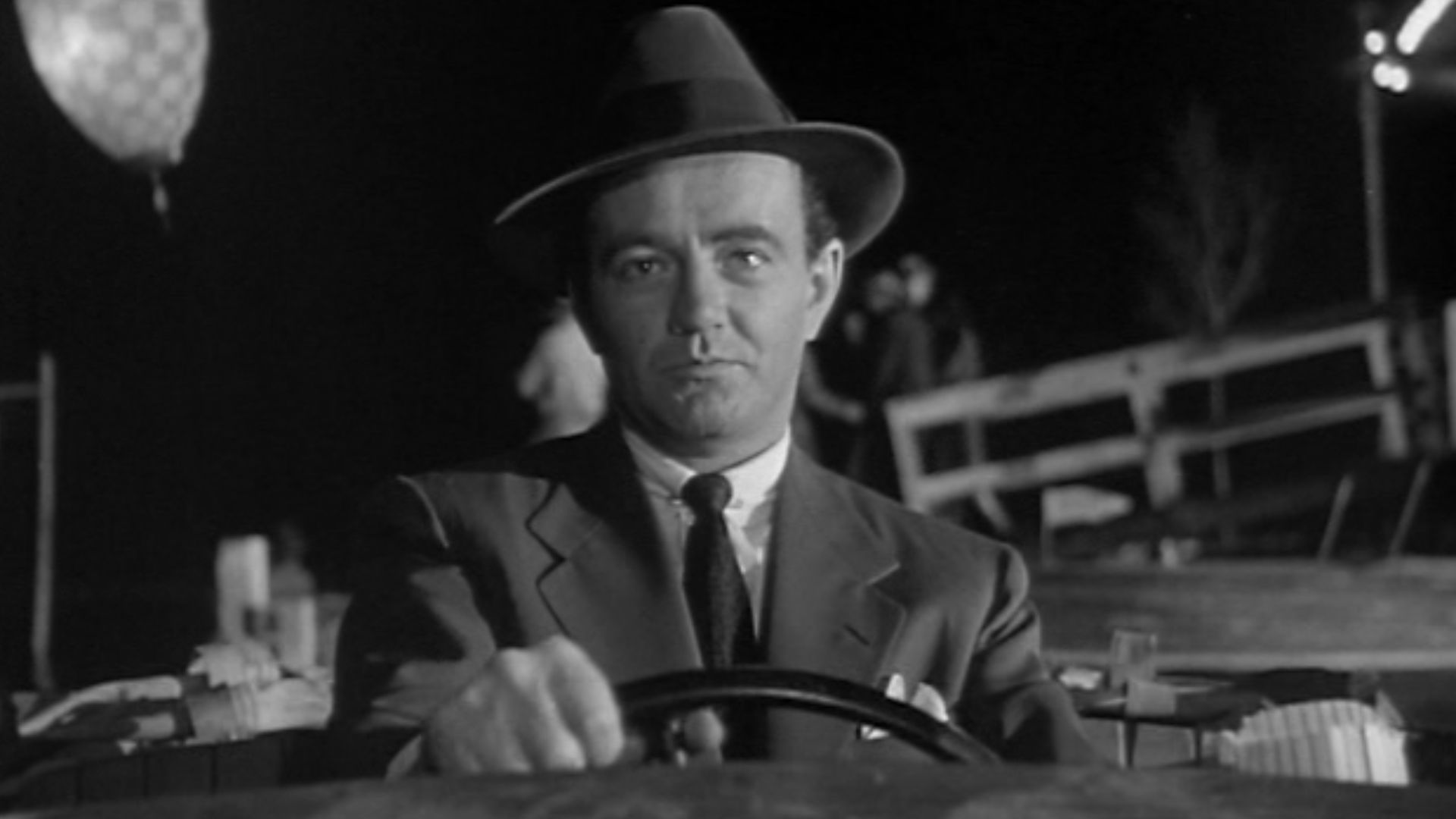 Bruno Anthony (Robert Walker) boating into the Tunnel of Love in Alfred Hitchcock's 1951 Strangers on a Train (trailer)